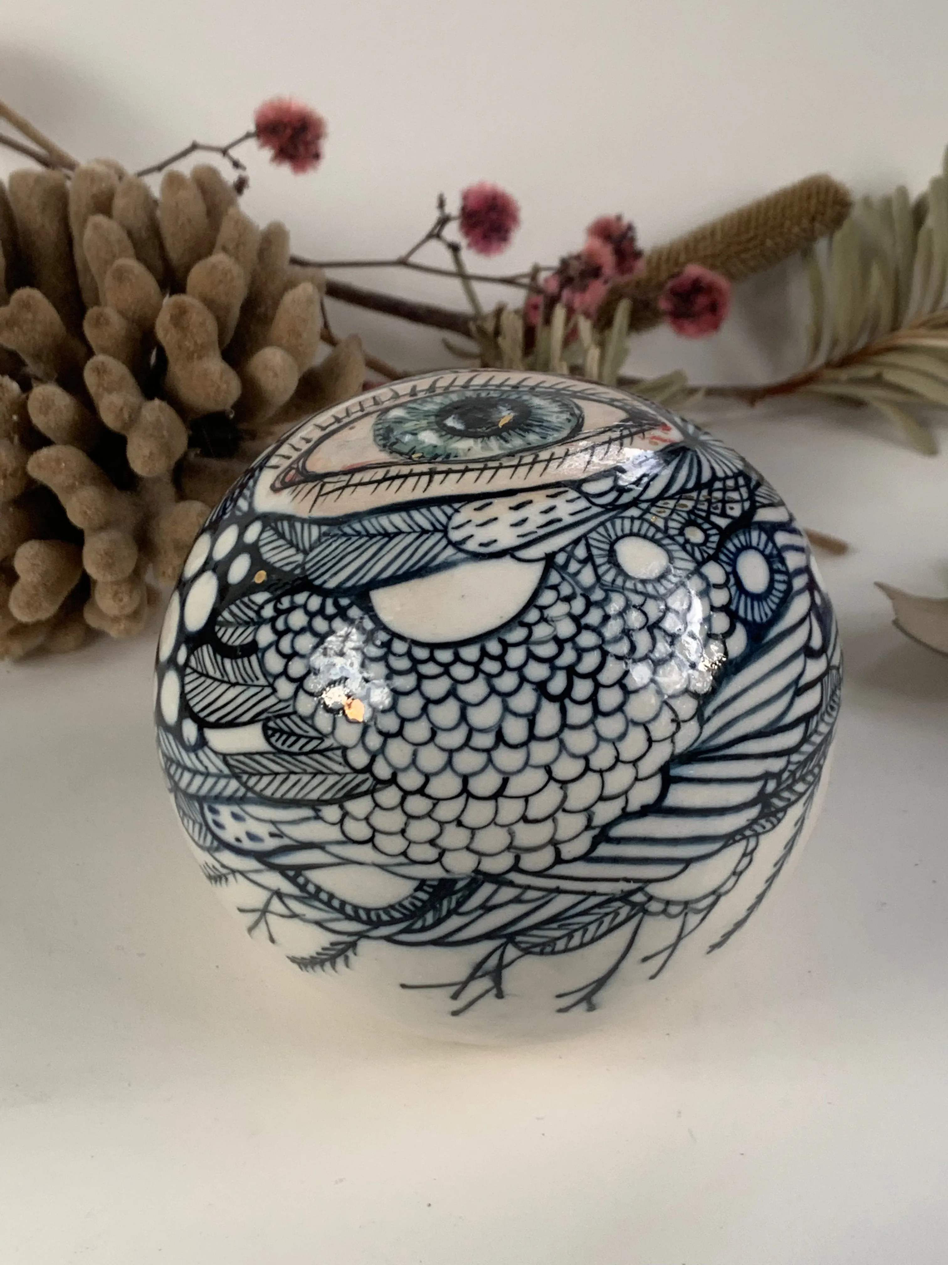 Hand painted porcelain paperweight with gold lustre details