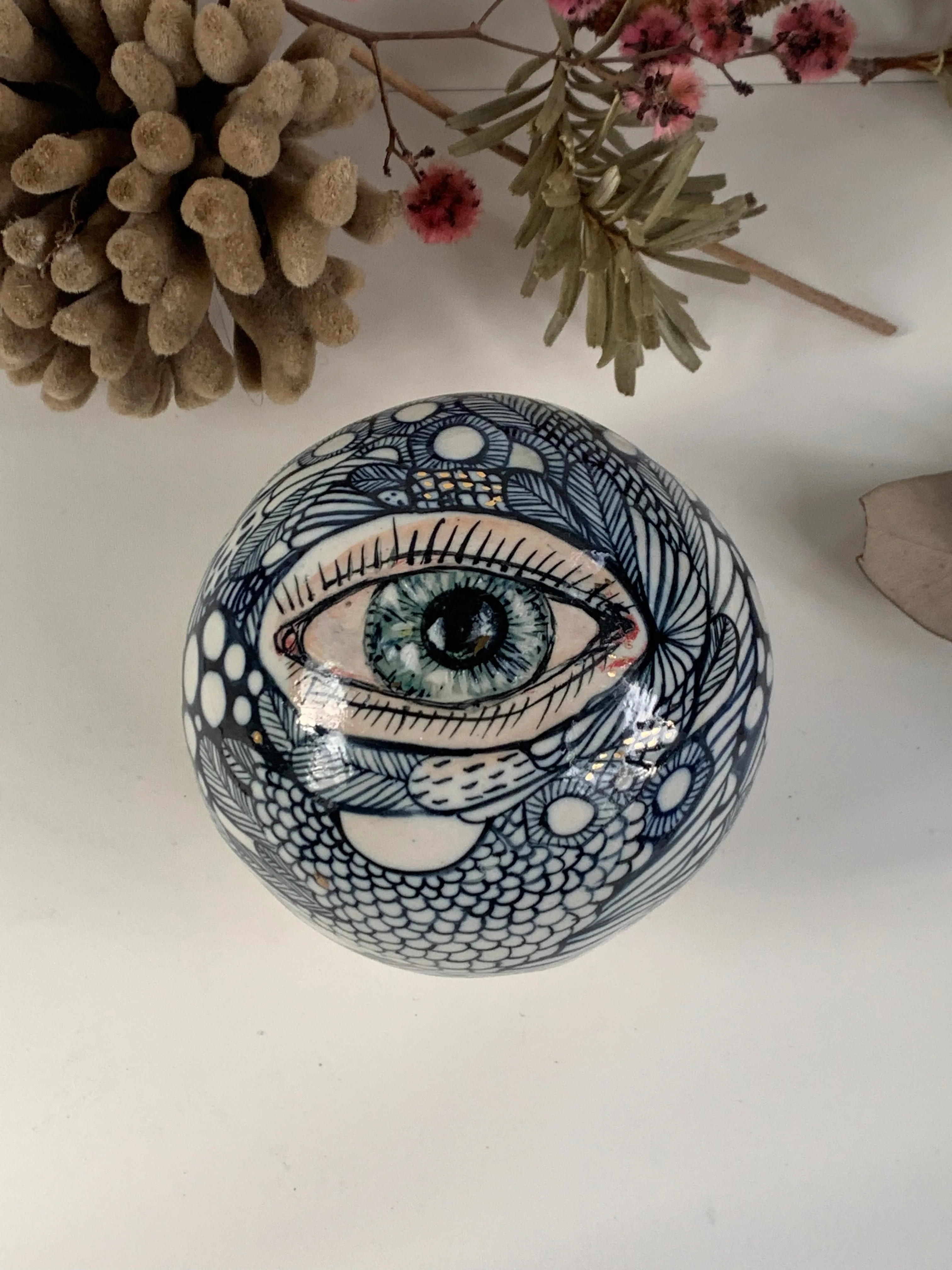 Hand painted porcelain paperweight with gold lustre details